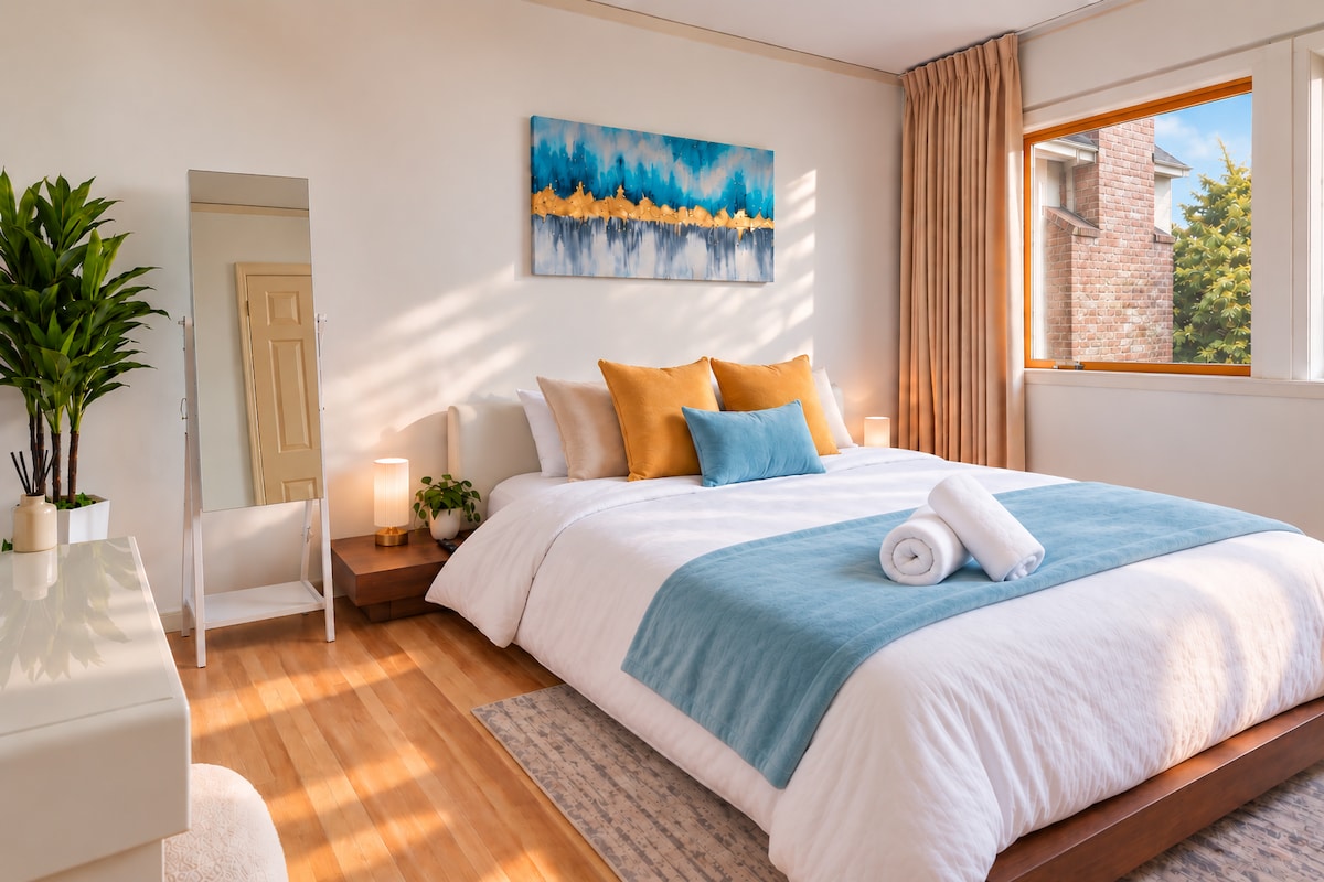 Queen bedroom with window light in the Berkeley Hills home