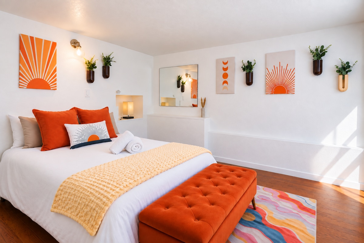 Studio bedroom with sun and moon wall art