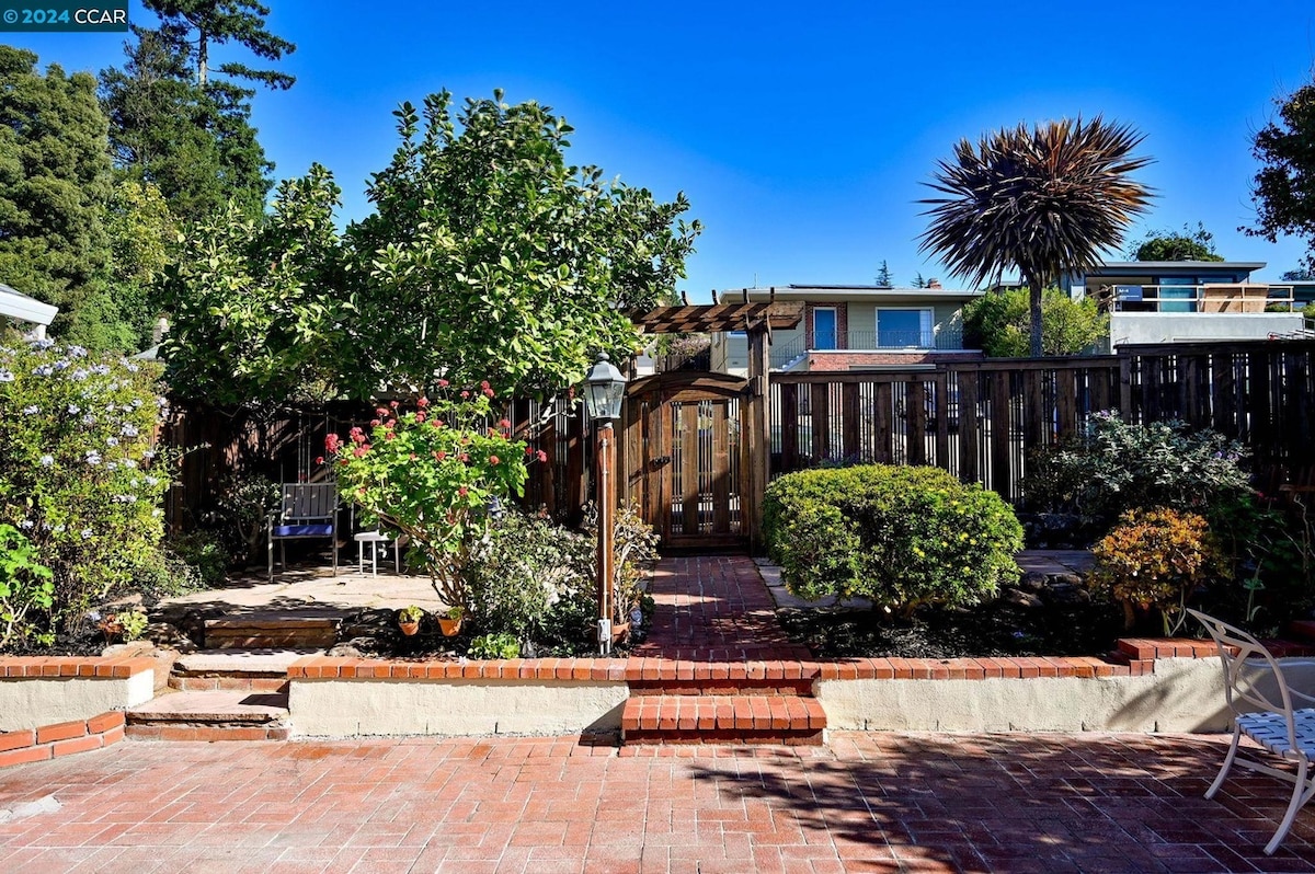 Shared brick patio and garden gate at the property
