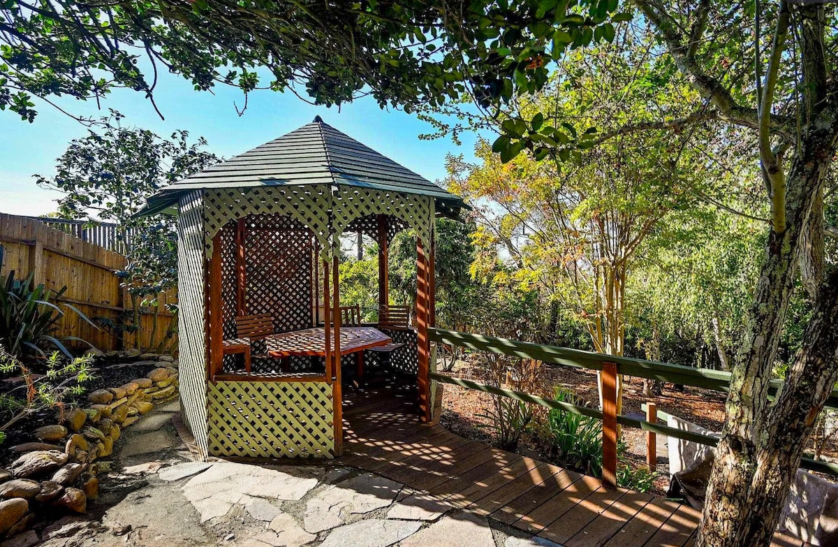Shared garden gazebo with seating for two